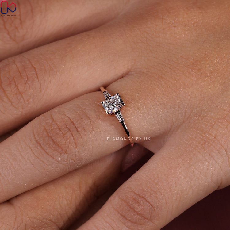 Diamondsbyuk engagement ring with a radiant cut diamond in a 4 prong setting.
