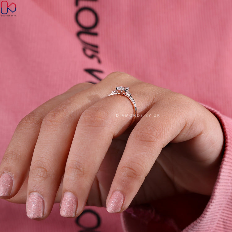 Handmade jewelry featuring a radiant cut diamond and tapered baguette diamonds.
