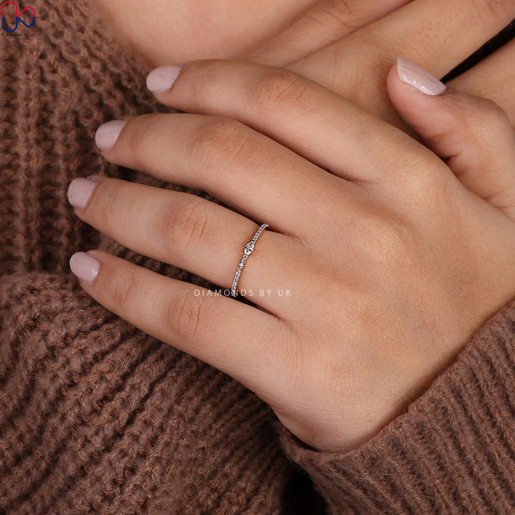 Handmade band with marquise cut diamonds for elegance.

