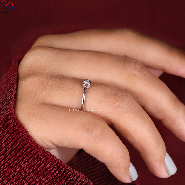Bezel set engagement ring in handmade jewelry.
