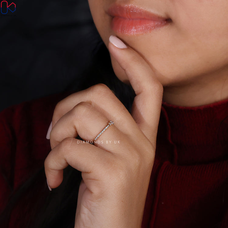 Handmade jewellery wedding band with prong set diamonds.
