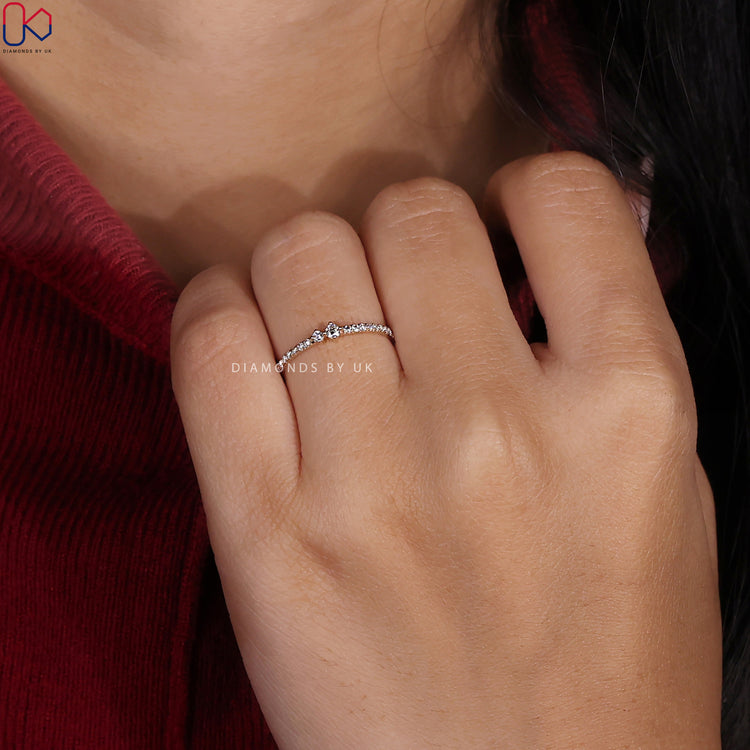Prong set band in yellow gold for classic wedding style.
