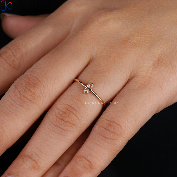 Diamondsbyuk two stone engagement ring with a yellow gold band.
