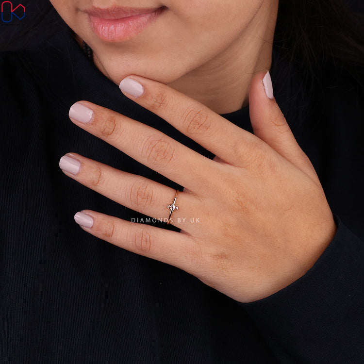 Handmade engagement ring with two diamonds in yellow gold.
