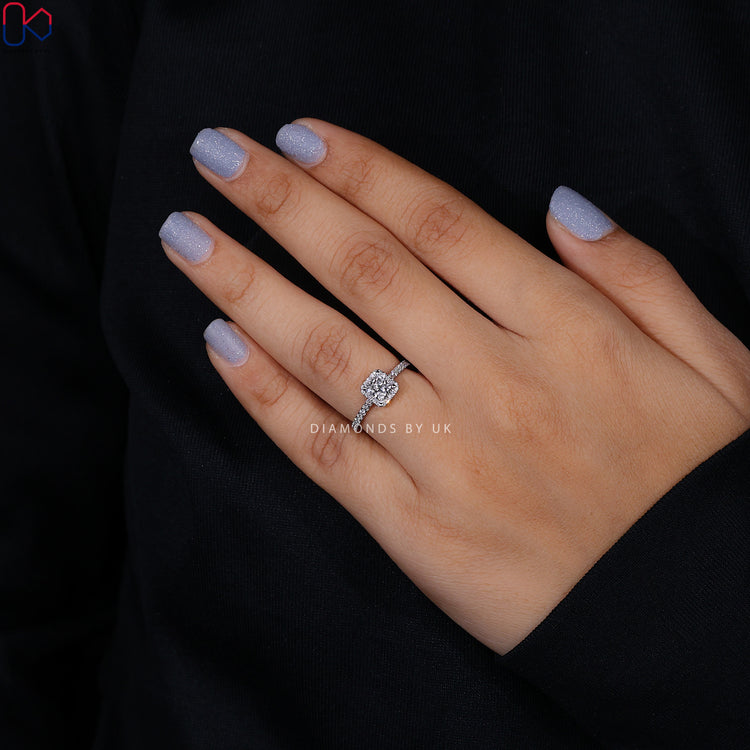 White gold engagement ring with round cut stone.
