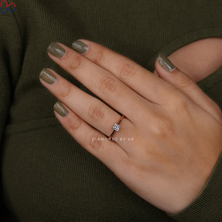 Solitaire princess diamond ring with 4 prong setting.