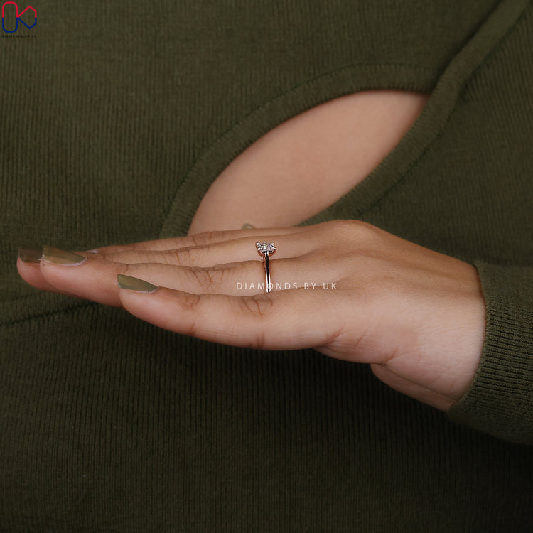 DiamondsbyUK rose gold ring with princess cut diamond.