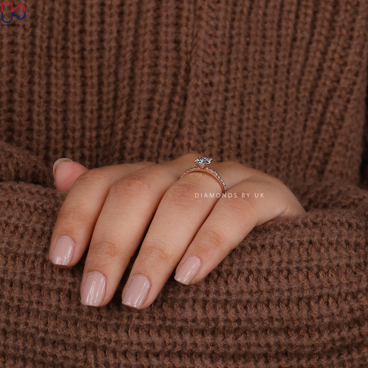 Prong setting engagement ring with princess center diamond.