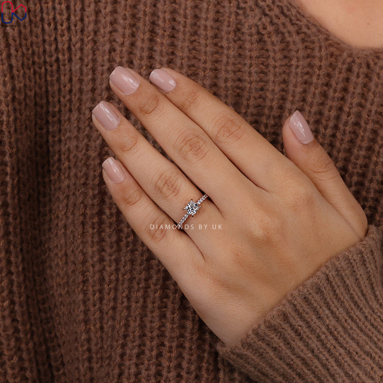 Round and princess diamond ring with prong and pave setting.