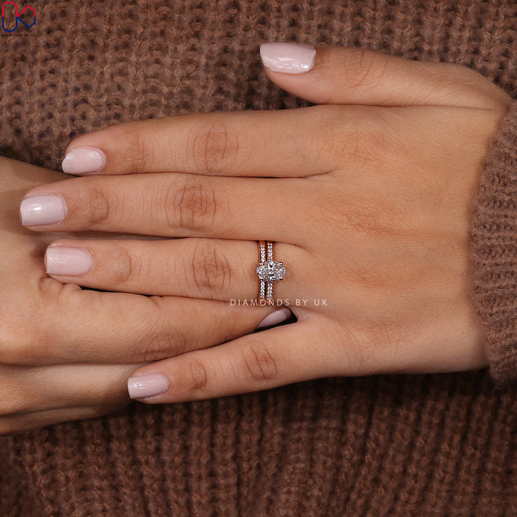 Half eternity wedding band paired with an oval engagement ring.
