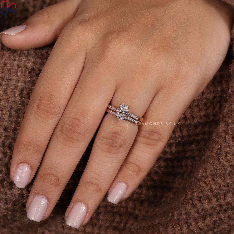 Custom bridal set with hidden halo ring and round diamond band.
