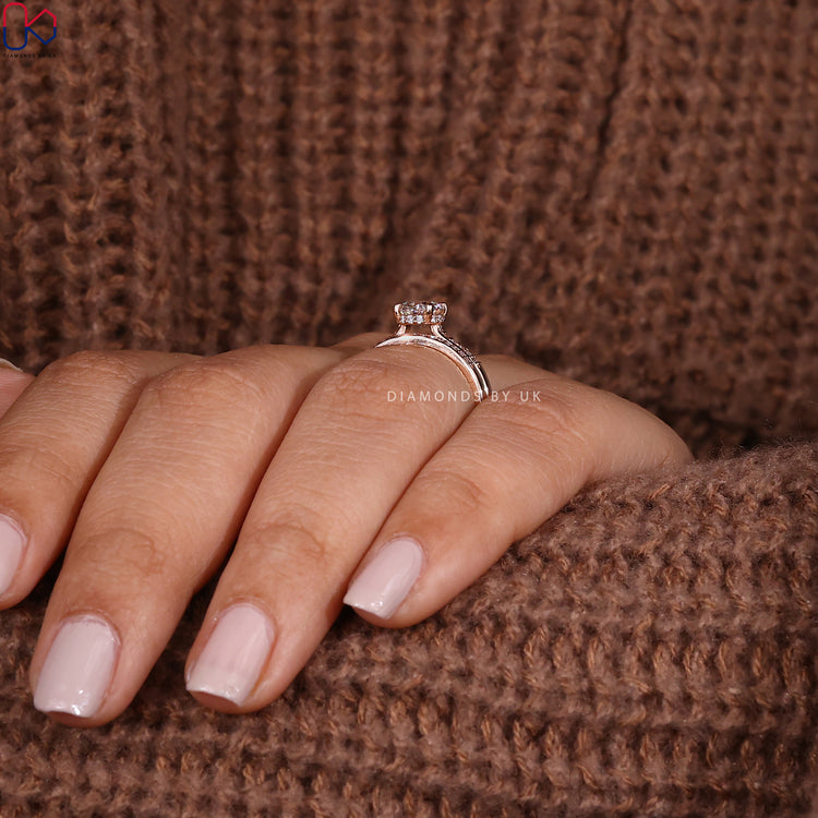 Rose gold bridal set with oval engagement ring and half eternity band.
