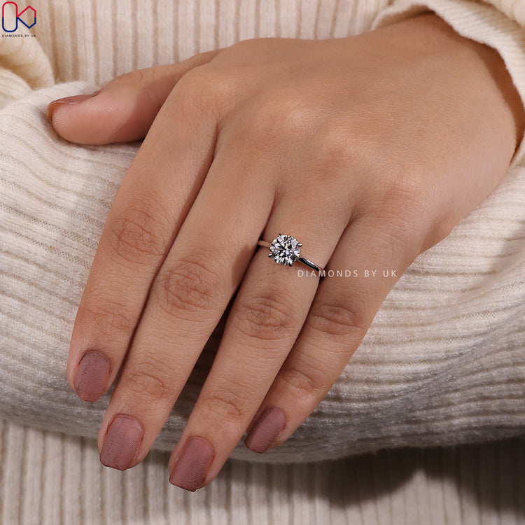 Claw prong setting ring showcasing a brilliant round diamond.
