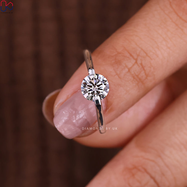Diamondsbyuk unique engagement ring with a round diamond.
