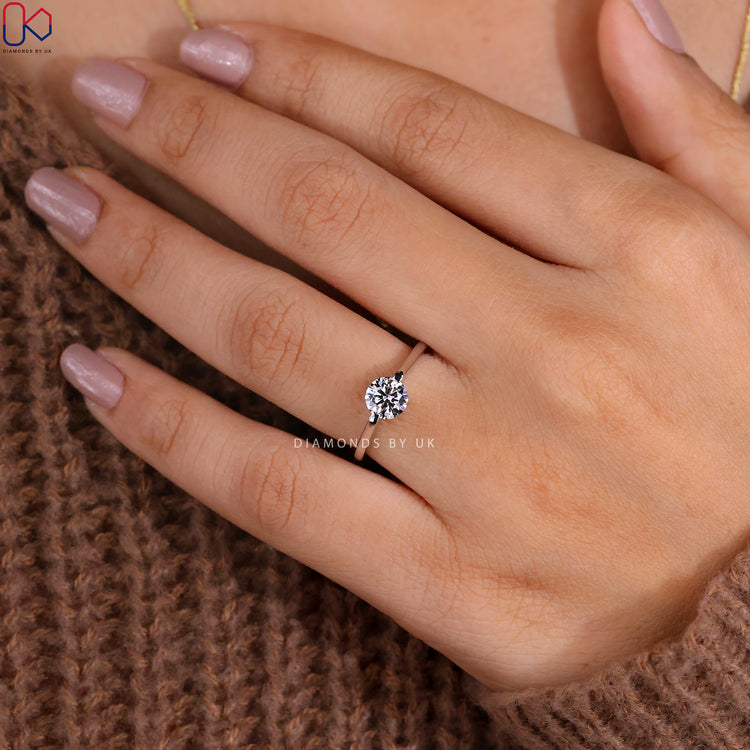 Handmade round solitaire ring with a sleek design.
