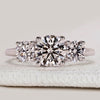 Three stone diamond ring with trellis side setting.
