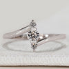 Three stone ring with round diamond bypass setting.
