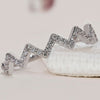 Zig zag diamond band in elegant white gold by Diamondsbyuk.
