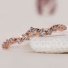 Rose gold wedding band with a sleek and modern design.
