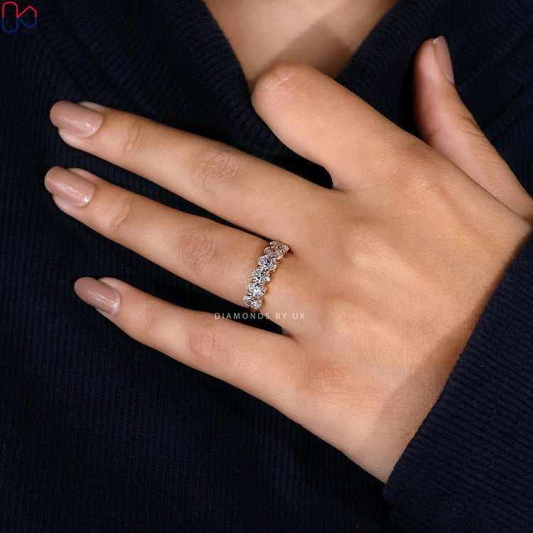 Half eternity diamond band perfect for layering or pairing with solitaire rings.
