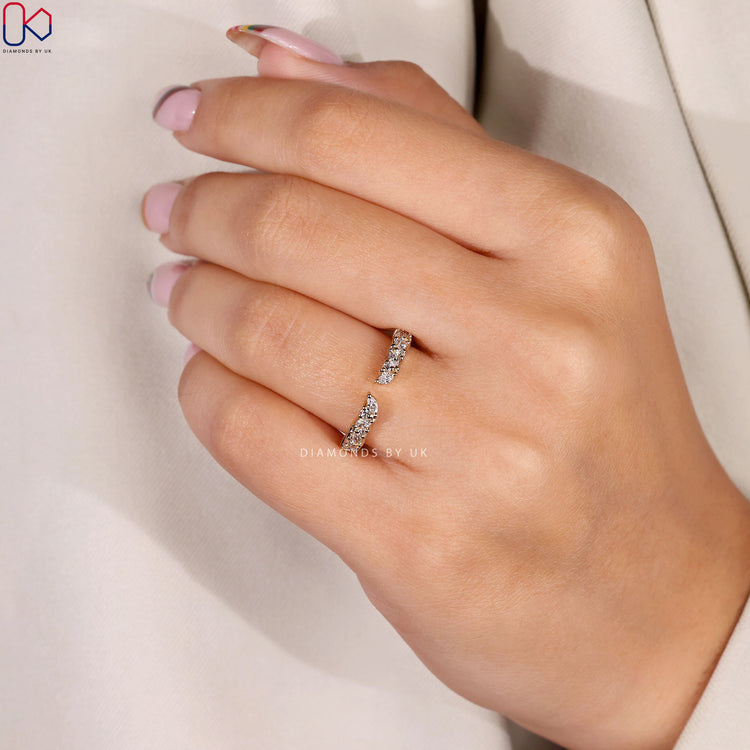 Stackable diamond wedding band featuring prong set round and marquise stones.
