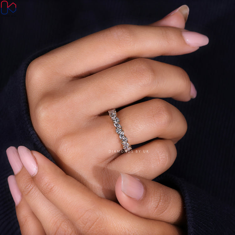 Half eternity wedding band with alternating marquise and round cuts in a custom design.
