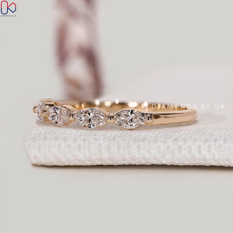 Marquise diamond wedding band with half eternity style.