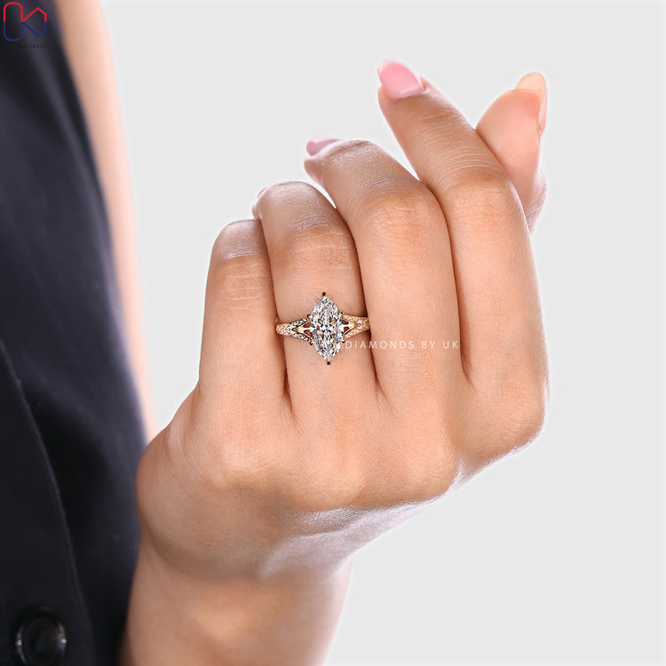 Vintage marquise cut diamond ring with split shank style.
