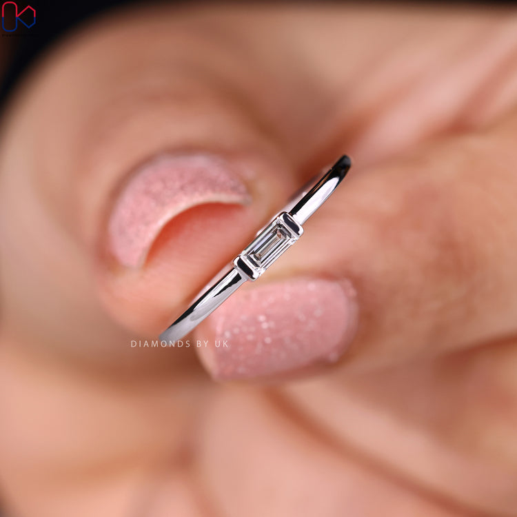 Lab grown diamond band with baguette cut solitaire.
