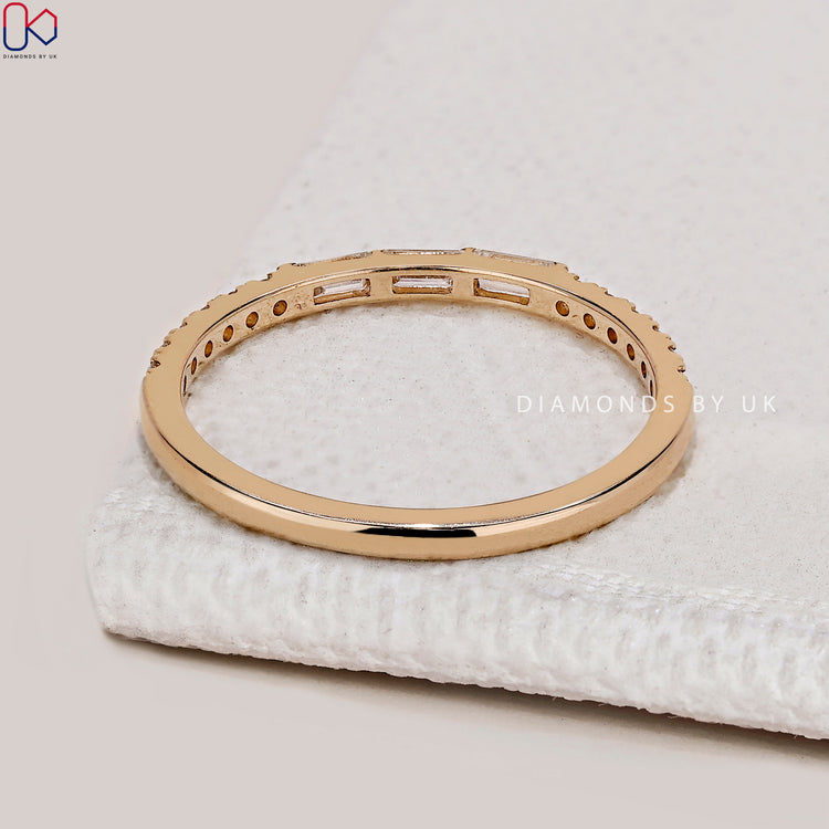 Lab grown diamond band with a bar setting.

