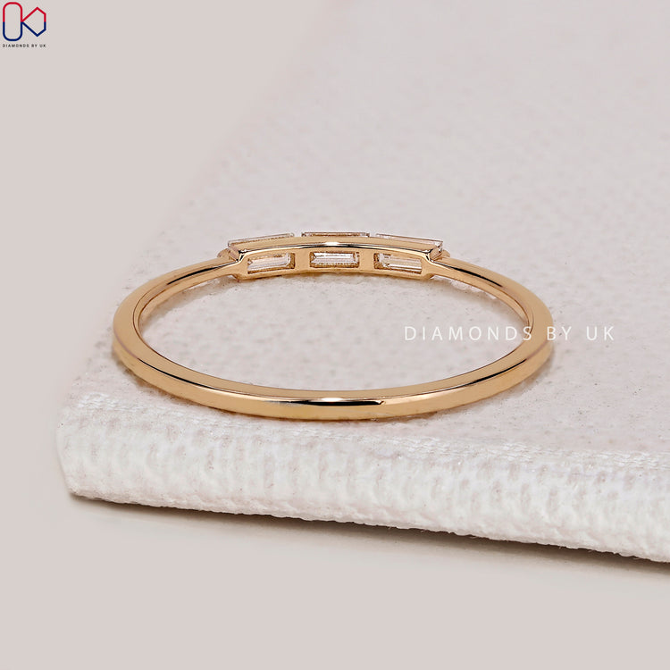 Lab grown baguette diamond band with bar setting.
