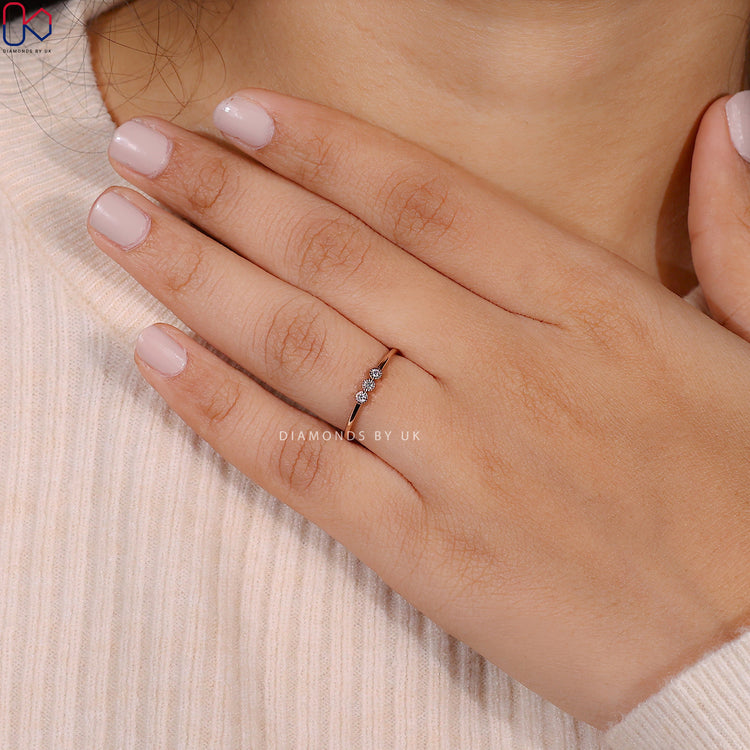 Handmade three stone round diamond wedding band.
