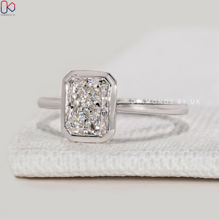 Handmade radiant ring with secure bezel setting.