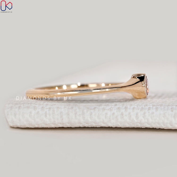 Handmade minimalist ring with round diamond bezel.