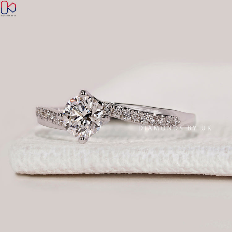 Round cut lab grown diamond engagement ring.