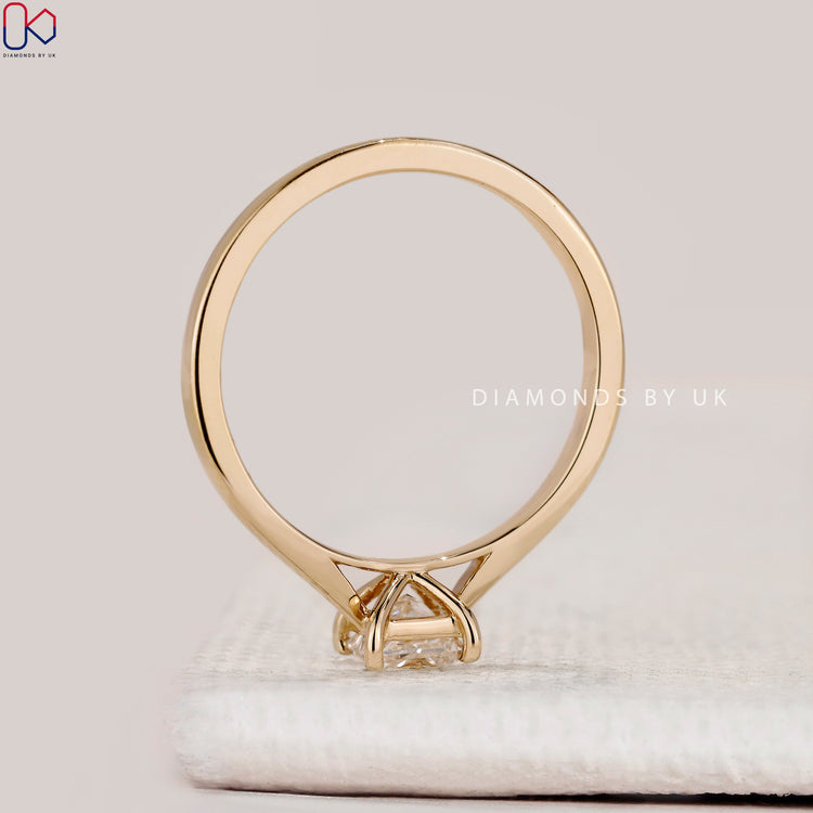 Cathedral princess cut ring with four prong style.