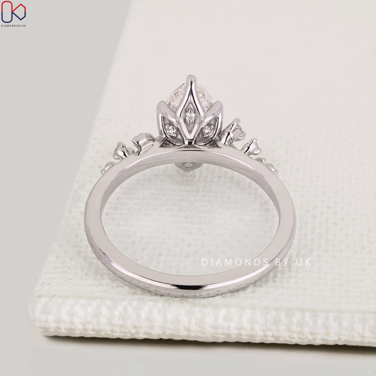 Handmade marquise engagement ring with tulip basket.
