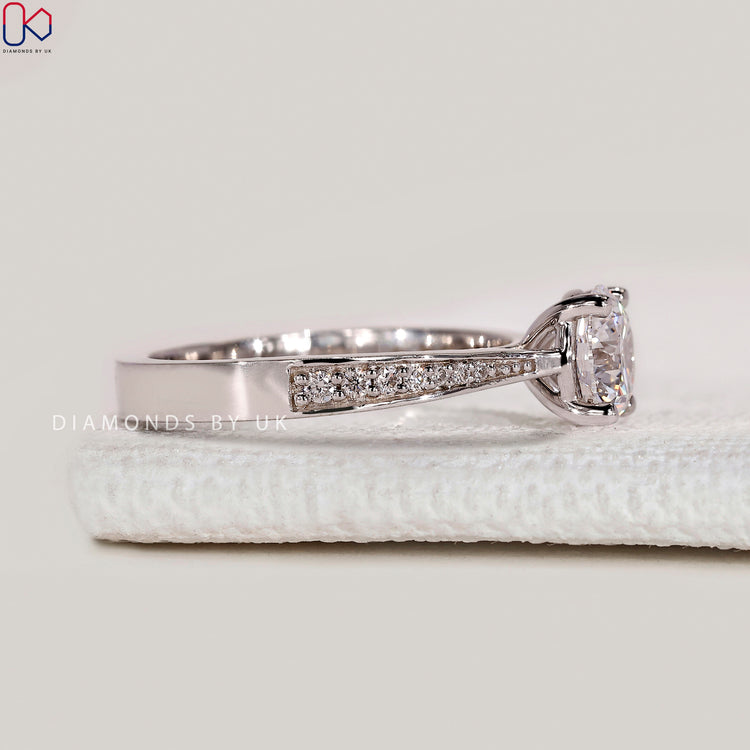 Handmade round cut ring with four prong setting