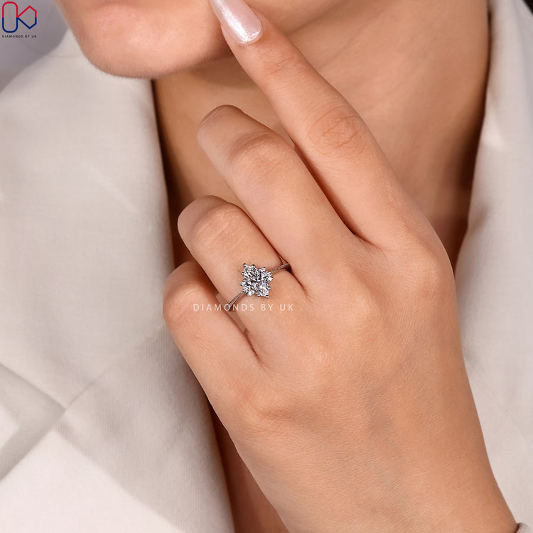Cathedral marquise ring with milgrain detailing.
