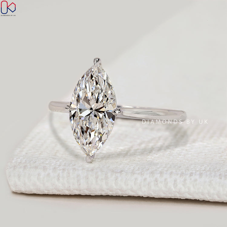 Handmade marquise ring with cathedral setting.