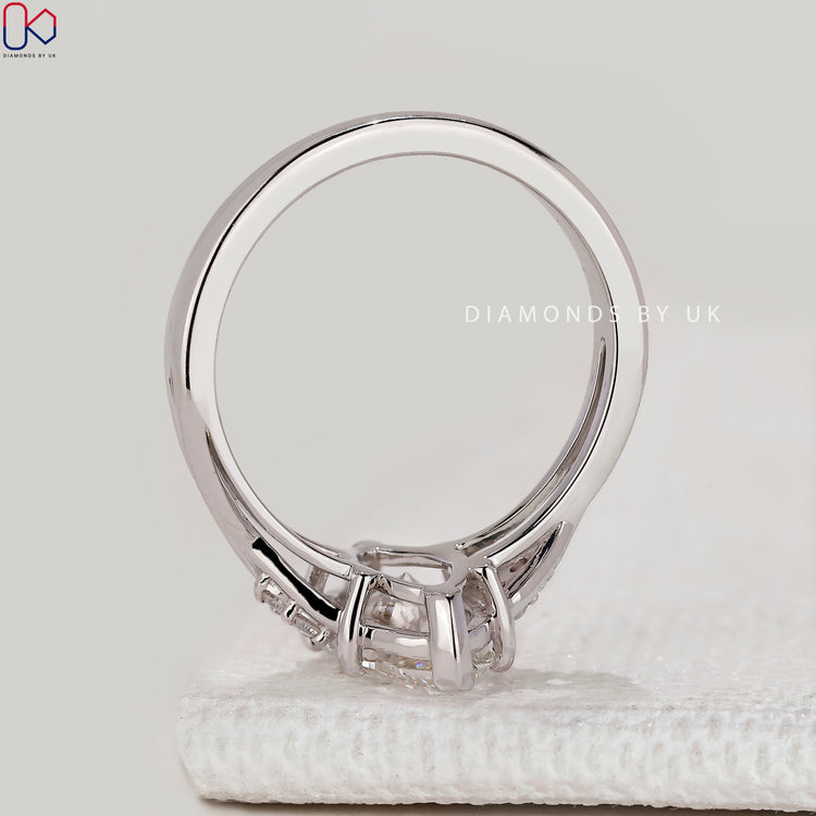 Marquise ring with round diamond side stones.
