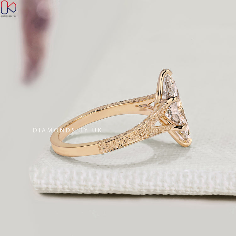 Lab grown marquise diamond ring with tulip setting.
