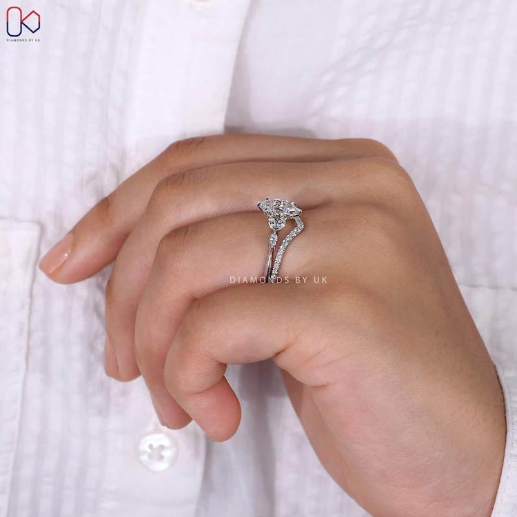 Marquise ring with round diamond half eternity band.