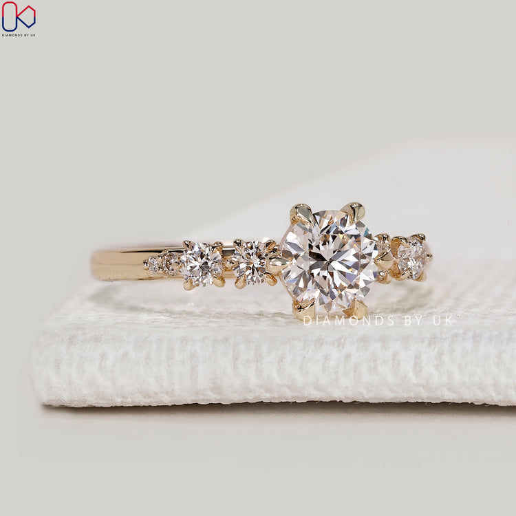 Handmade round cut ring with side stone setting.