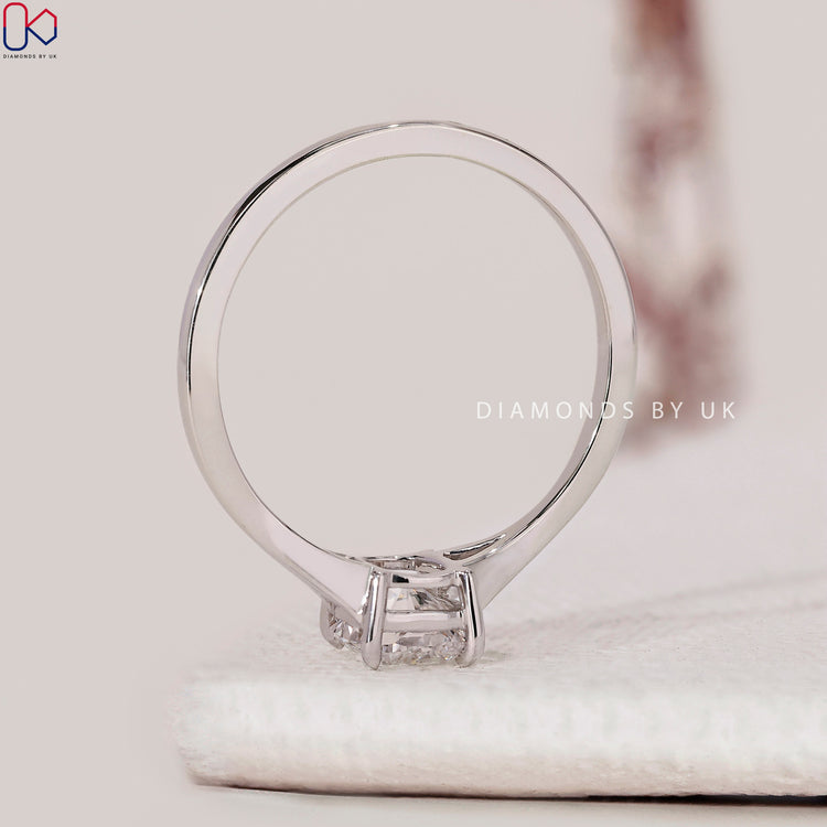 Cushion cut ring with claw prong setting, handmade.