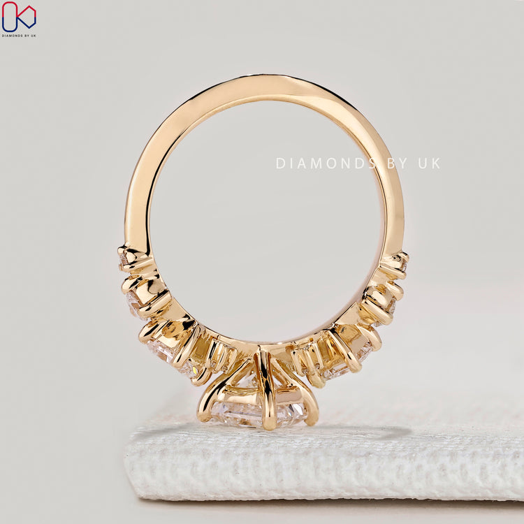 Princess ring with round and princess side diamonds.