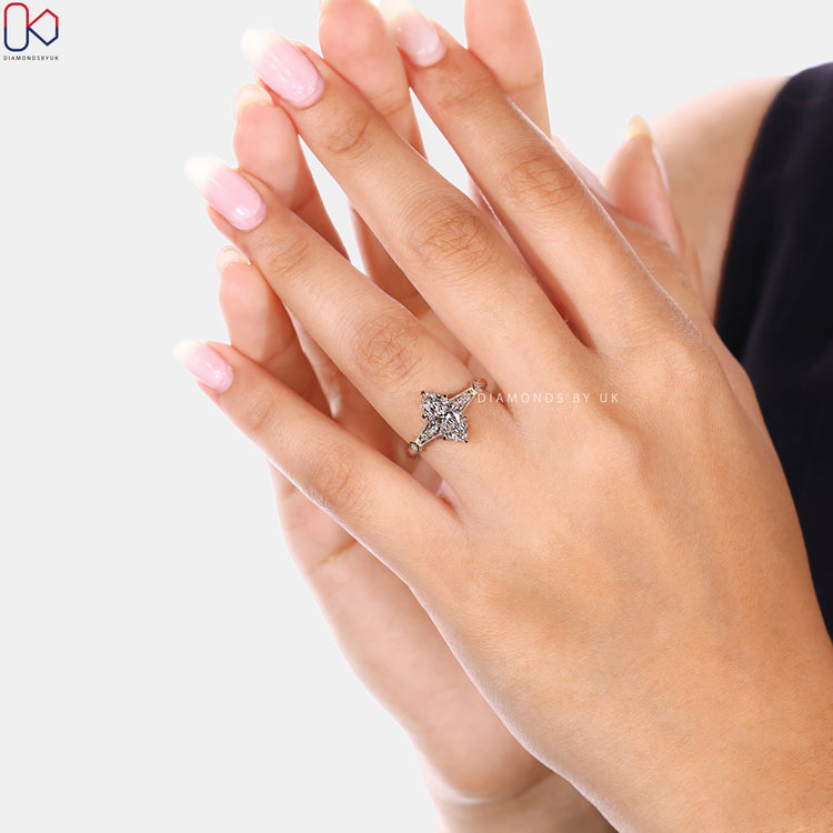 Handmade marquise diamond ring with hidden halo detail.
