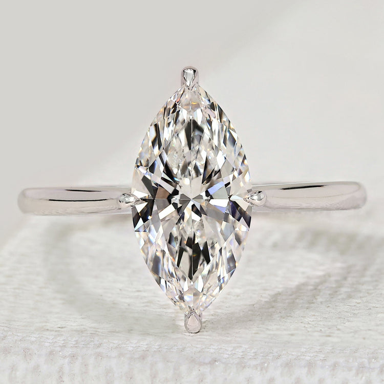Marquise diamond engagement ring with solitaire style.