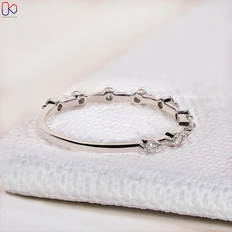 Lab grown round diamond wedding band with distance pavé.