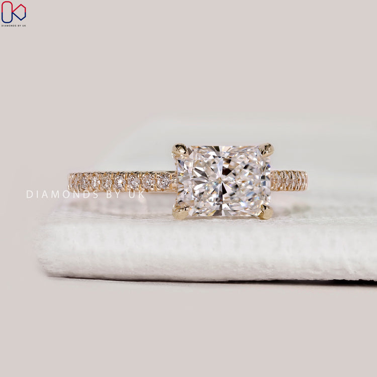Radiant cut lab grown diamond ring with pavé band.